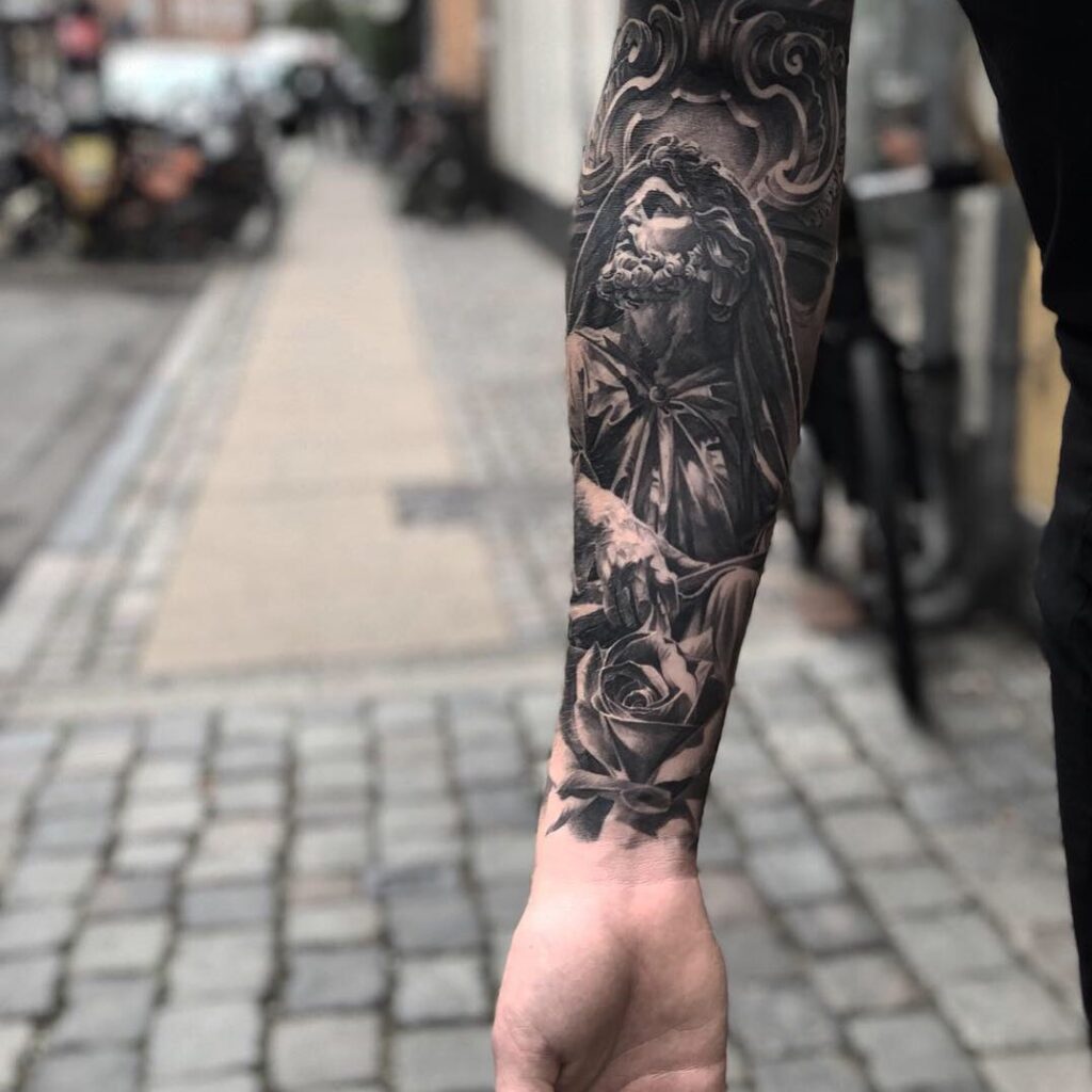 Black and grey forearm tattoo